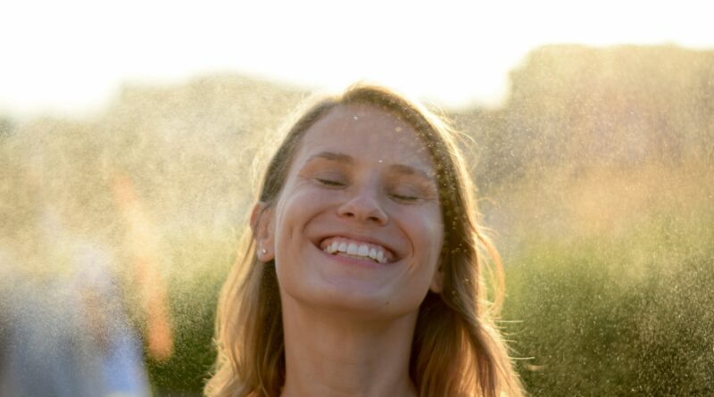 woman in white shirt smiling